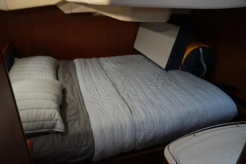 Marabelle Yacht Photos Pics Cozy cabin bedroom in a 2005 Hunter 41 AC sailboat with neatly made bed.