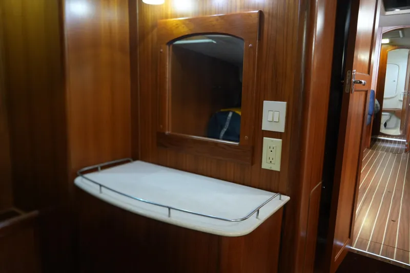Marabelle Yacht Photos Pics Interior of 2005 Hunter 41 AC yacht with wooden paneling and mirror.