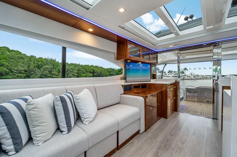  Yacht Photos Pics Luxurious interior of 2026 Riviera 6000 Sport Yacht with modern design and scenic views.