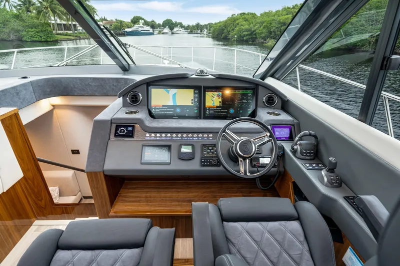  Yacht Photos Pics Helm of 2026 Riviera 6000 Sport Yacht with advanced navigation systems.