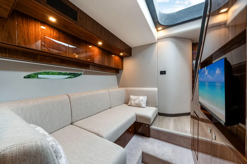  Yacht Photos Pics Luxurious interior of 2026 Riviera 6000 Sport Yacht with plush seating and modern amenities.