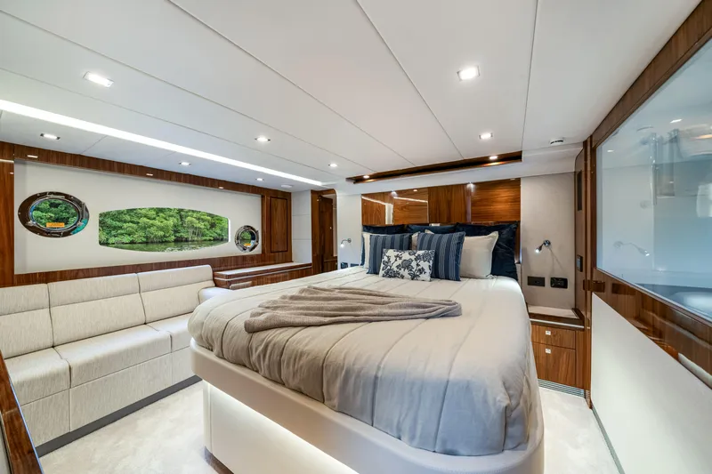  Yacht Photos Pics Luxurious interior of 2026 Riviera 6000 Sport Yacht with elegant bedroom design.