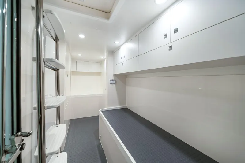  Yacht Photos Pics 2026 Riviera 6000 Sport Yacht interior with sleek white cabinetry and modern design.