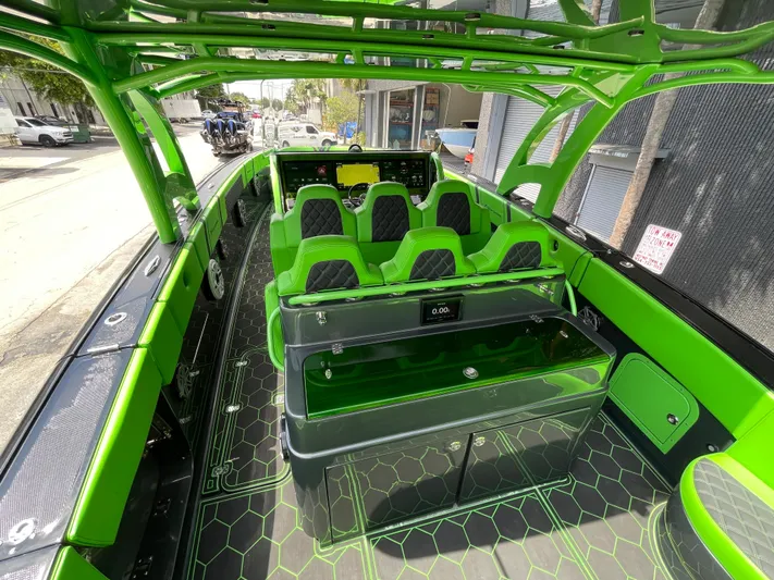  Yacht Photos Pics 2020 Midnight Express boat interior with green and black seating and modern dashboard.