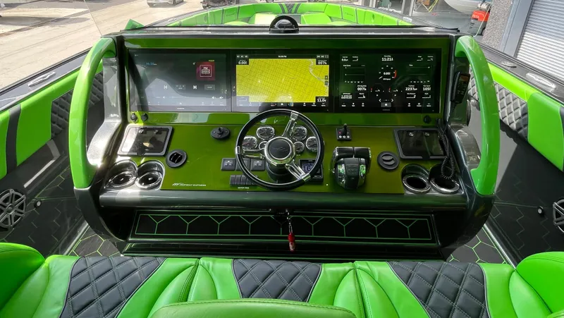  Yacht Photos Pics 2020 Midnight Express boat dashboard with green and black leather seats, advanced navigation system.