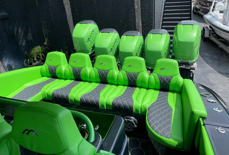  Yacht Photos Pics Green and black 2020 Midnight Express boat with multiple outboard engines.
