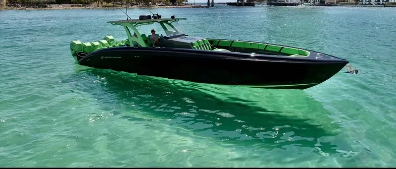  Yacht Photos Pics Midnight Express 2020 model boat cruising on clear turquoise water.