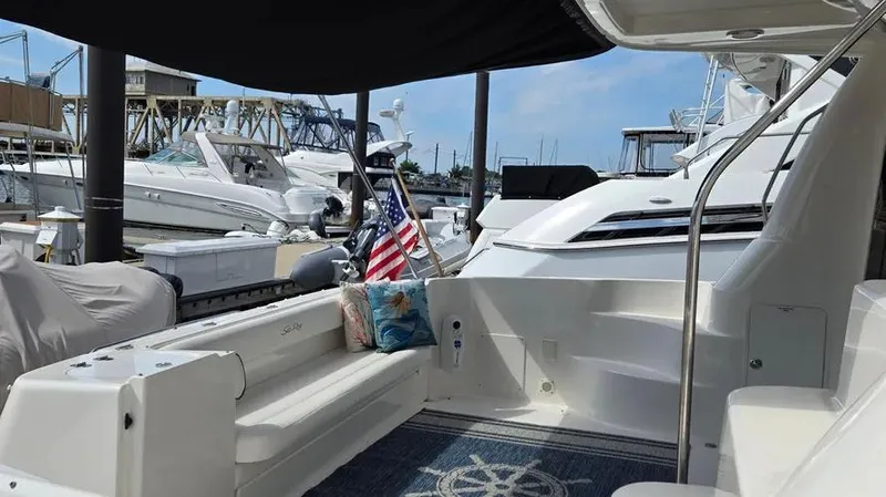  Yacht Photos Pics 2007 Sea Ray 580 Sedan Bridge yacht interior with seating and American flag.