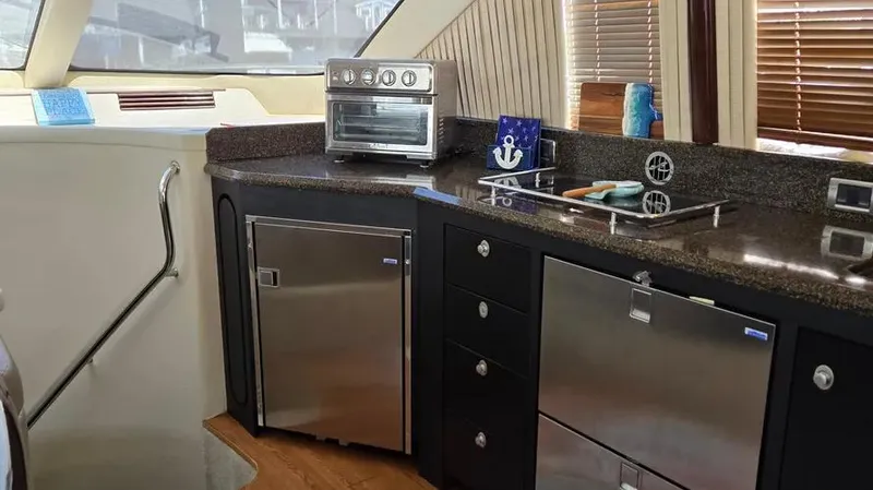  Yacht Photos Pics Luxurious kitchen area in 2007 Sea Ray 580 Sedan Bridge yacht.