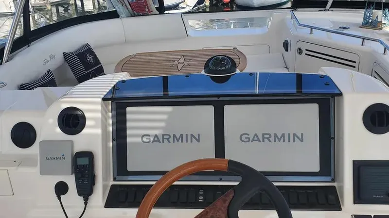  Yacht Photos Pics 2007 Sea Ray 580 Sedan Bridge helm with Garmin navigation displays.