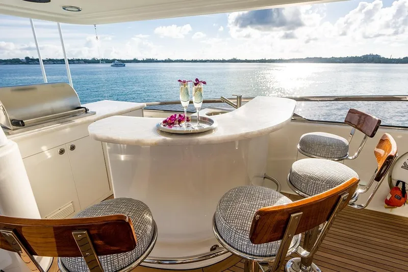 Kemosabe Yacht Photos Pics Luxurious yacht bar on 2007 Westport 112, overlooking serene ocean view.