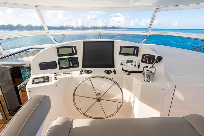 Kemosabe Yacht Photos Pics Helm of 2007 Westport 112 yacht with navigation equipment and ocean view.