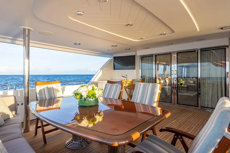 Kemosabe Yacht Photos Pics Luxurious 2007 Westport 112 yacht deck with elegant dining area and ocean view.