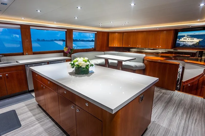 Kemosabe Yacht Photos Pics Luxurious interior of 2007 Westport 112 yacht with modern kitchen and dining area.