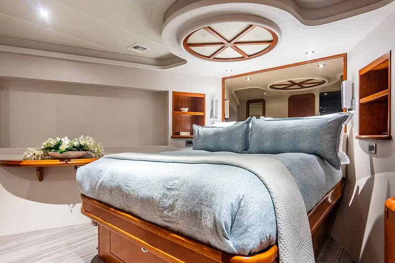 Kemosabe Yacht Photos Pics Luxurious bedroom interior of 2007 Westport 112 yacht with elegant bedding and wood accents.