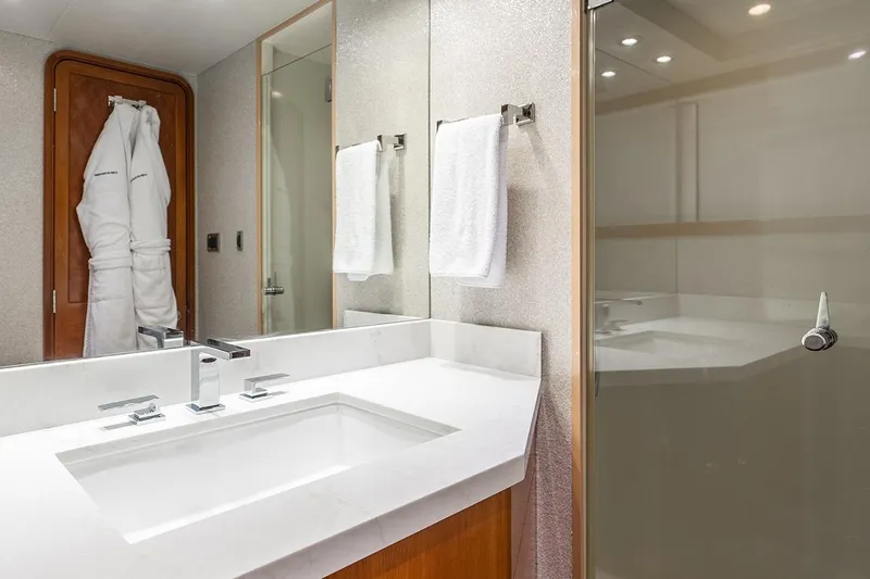 Kemosabe Yacht Photos Pics Luxurious bathroom in 2007 Westport 112 yacht with modern fixtures and elegant design.