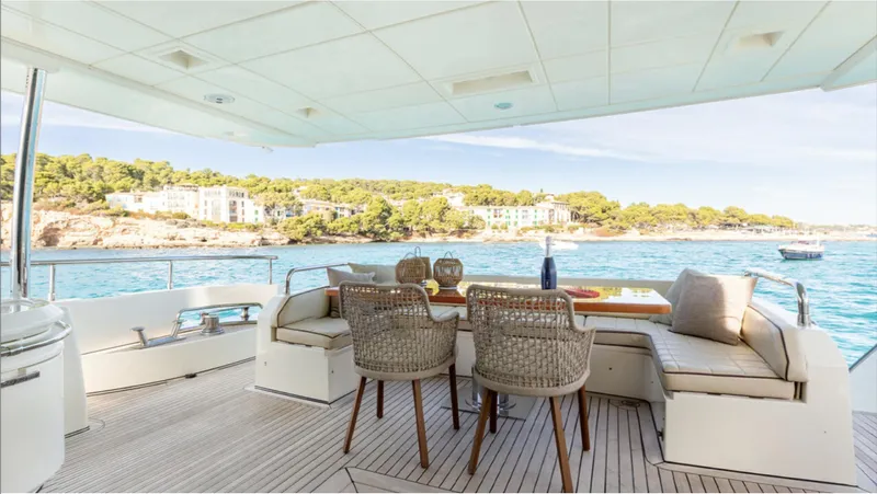  Yacht Photos Pics Luxurious 2008 Azimut 75 yacht deck with elegant seating, overlooking serene coastal waters.