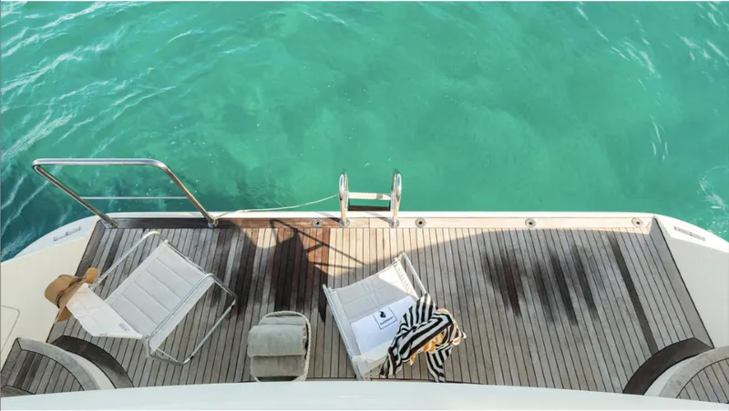  Yacht Photos Pics Luxury Azimut 75 yacht deck with chairs overlooking turquoise water, 2008 model.