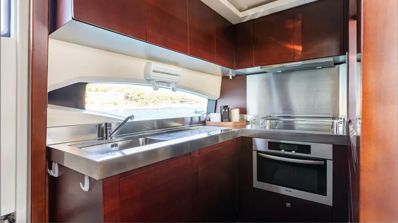  Yacht Photos Pics Luxurious kitchen interior of 2008 Azimut 75 yacht with modern appliances and sleek design.