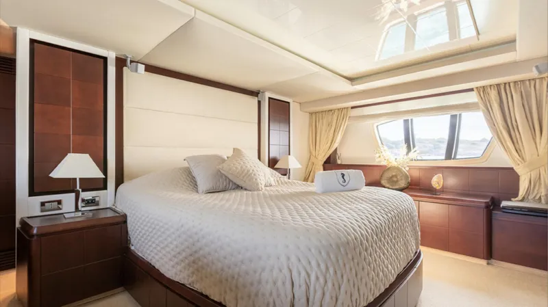  Yacht Photos Pics Luxurious bedroom interior on 2008 Azimut 75 yacht with elegant decor and large windows.