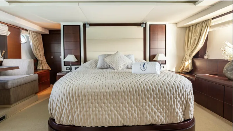  Yacht Photos Pics Luxurious bedroom interior of a 2008 Azimut 75 yacht with elegant bedding and decor.