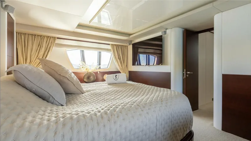  Yacht Photos Pics Luxurious bedroom interior of 2008 Azimut 75 yacht with elegant bedding and natural light.