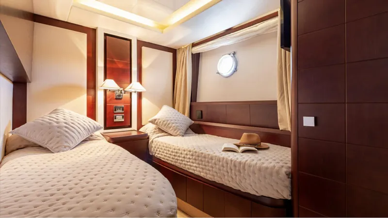  Yacht Photos Pics Luxurious twin cabin on 2008 Azimut 75 yacht with elegant decor and cozy bedding.