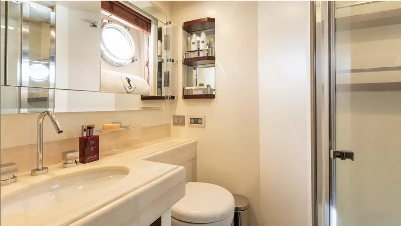  Yacht Photos Pics Luxurious bathroom in 2008 Azimut 75 yacht with modern fixtures and porthole window.