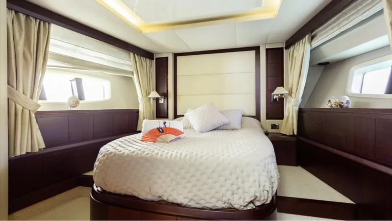  Yacht Photos Pics Luxurious bedroom interior of a 2008 Azimut 75 yacht with elegant bedding and windows.