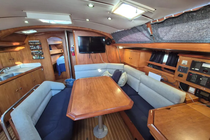 Time Warp Yacht Photos Pics Interior of 2000 Jeanneau Sun Odyssey 45.2 yacht with cozy seating and modern amenities.