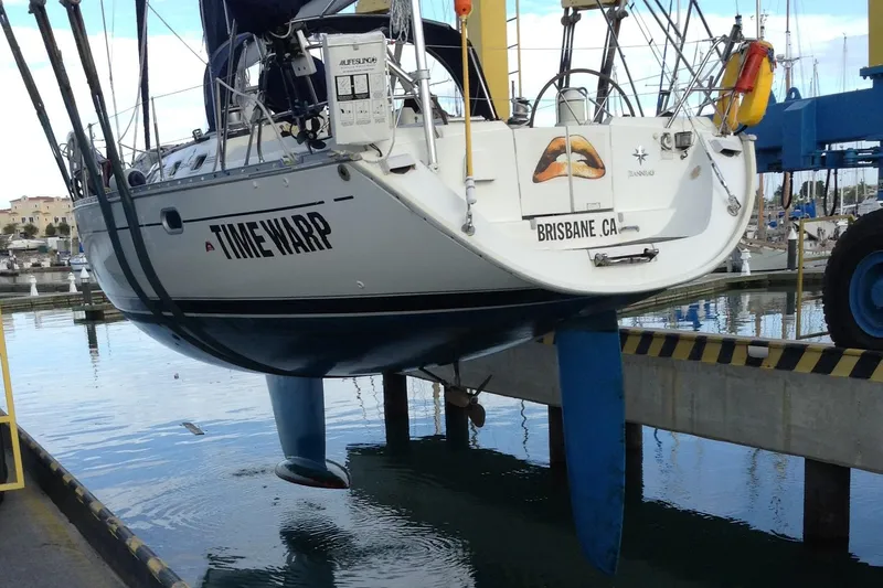 Time Warp Yacht Photos Pics Jeanneau Sun Odyssey 45.2 sailboat, "Timewarp," lifted at a marina, Brisbane, CA, 2000 model.