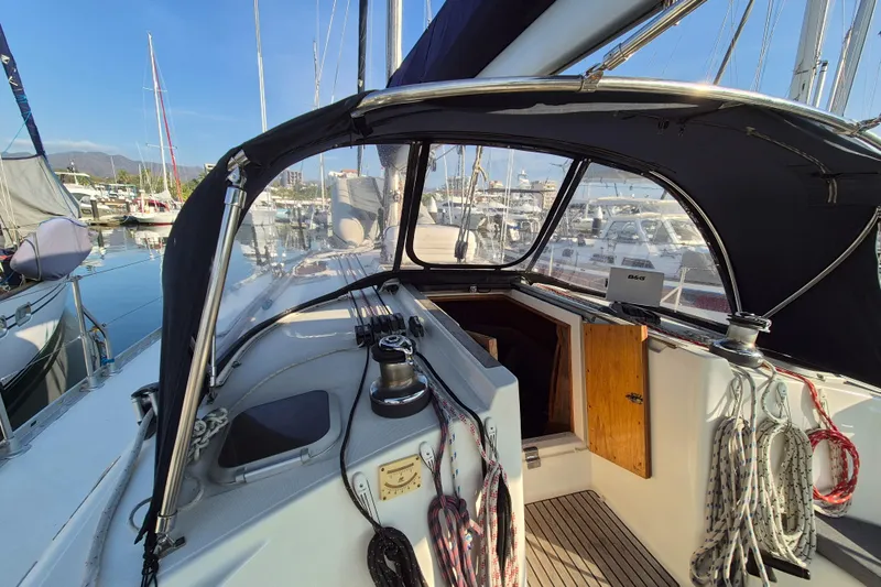 Time Warp Yacht Photos Pics Cockpit view of 2000 Jeanneau Sun Odyssey 45.2 sailboat in marina.