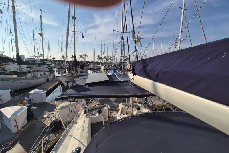 Time Warp Yacht Photos Pics Jeanneau Sun Odyssey 45.2 sailboat docked at marina, 2000 model.