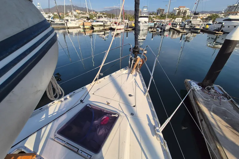 Time Warp Yacht Photos Pics Jeanneau Sun Odyssey 45.2 sailboat docked in a marina, 2000 model.