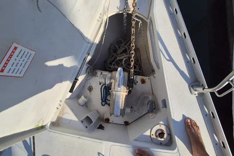 Time Warp Yacht Photos Pics Anchor locker of 2000 Jeanneau Sun Odyssey 45.2 sailboat with chain and ropes.