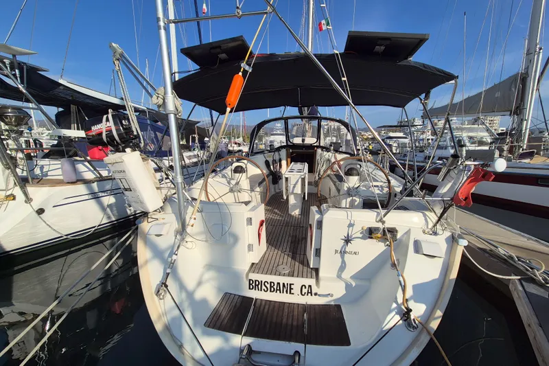 Time Warp Yacht Photos Pics Jeanneau Sun Odyssey 45.2 sailboat docked at marina, rear view, 2000 model.