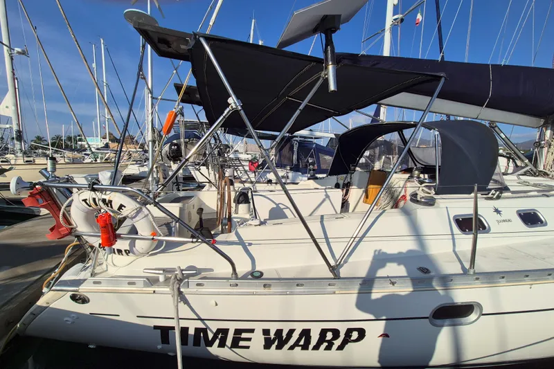 Time Warp Yacht Photos Pics Jeanneau Sun Odyssey 45.2 sailboat docked, featuring "Time Warp" name, 2000 model.