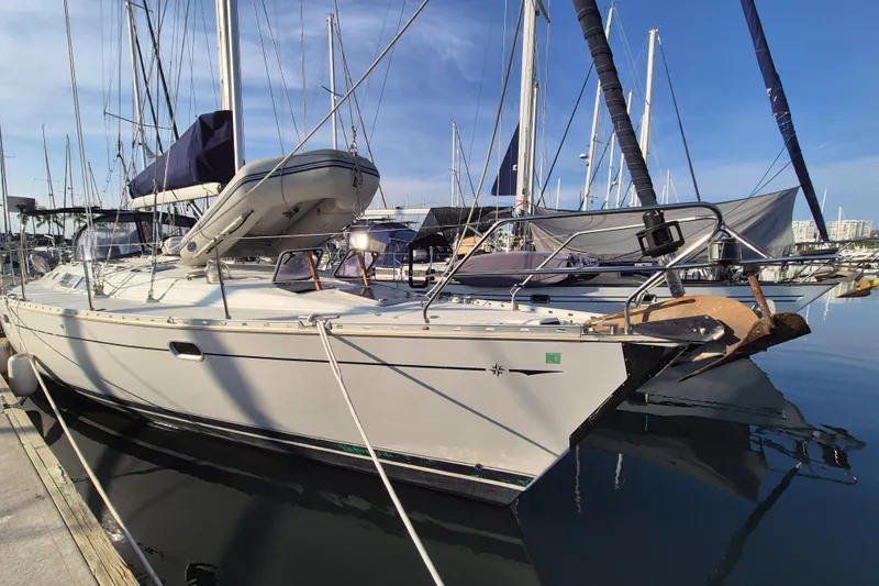 Time Warp Yacht Photos Pics Jeanneau Sun Odyssey 45.2 sailboat docked in marina, 2000 model.