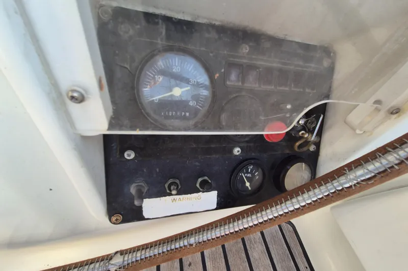 Time Warp Yacht Photos Pics Control panel of a 2000 Jeanneau Sun Odyssey 45.2 sailboat, featuring gauges and switches.
