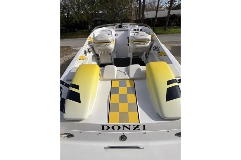  Yacht Photos Pics 2002 Donzi 38 Daytona boat with yellow checkered design and dual seats.