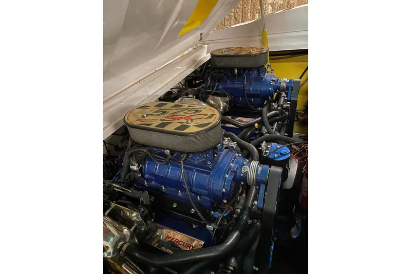  Yacht Photos Pics Twin Mercury engines in a 2002 Donzi 38 Daytona boat, showcasing powerful performance.