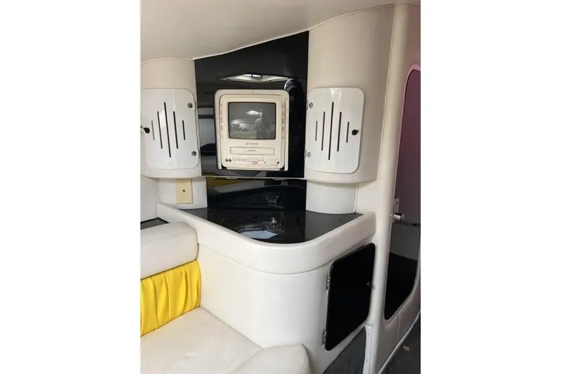  Yacht Photos Pics Interior of 2002 Donzi 38 Daytona boat with seating and built-in TV.