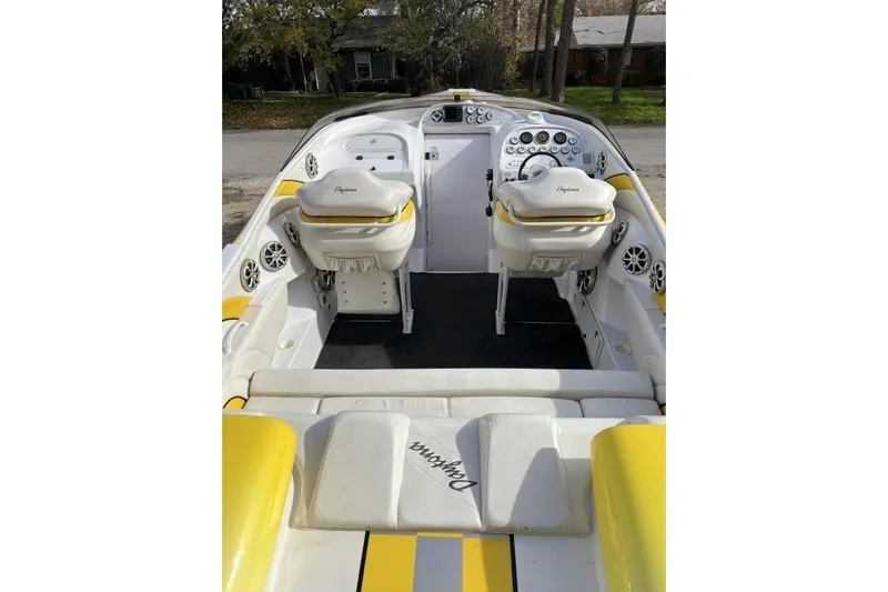  Yacht Photos Pics 2002 Donzi 38 Daytona boat interior with yellow and white seating, dashboard, and controls.