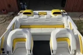  Yacht Photos Pics 2002 Donzi 38 Daytona boat interior with white and yellow seating.