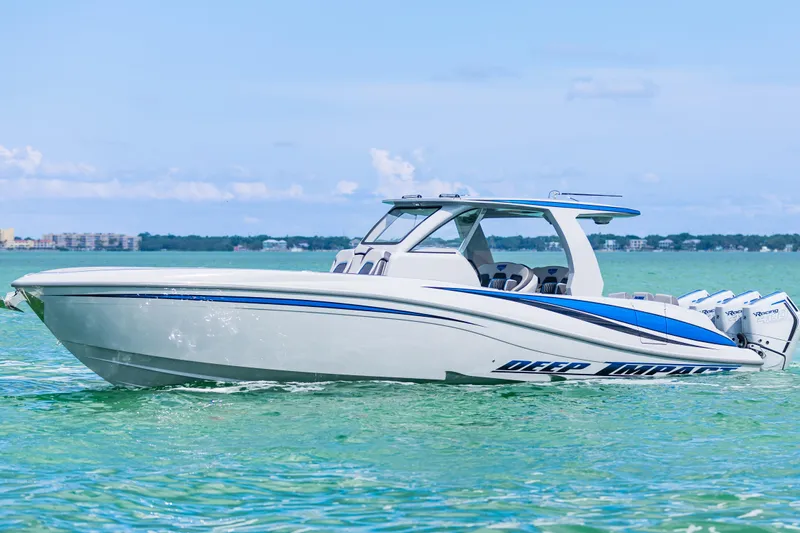  Yacht Photos Pics 2023 Deep Impact 399 Sport boat on clear turquoise water.