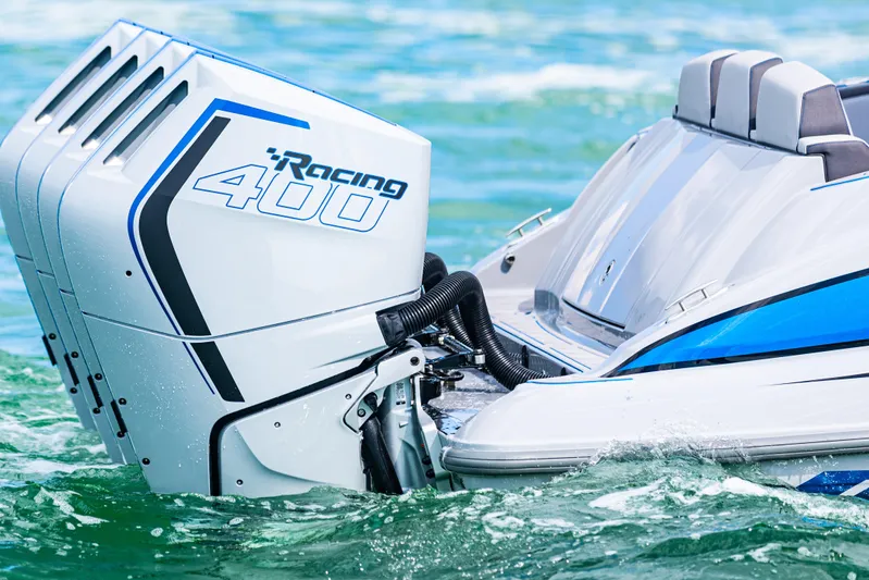  Yacht Photos Pics 2023 Deep Impact 399 Sport boat with Racing 400 engines on water.