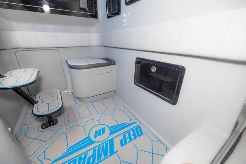  Yacht Photos Pics 2023 Deep Impact 399 Sport interior with modern seating and sleek design.