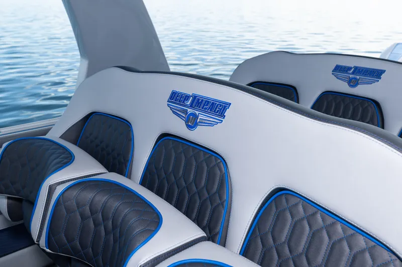  Yacht Photos Pics Luxury seating in 2023 Deep Impact 399 Sport boat, featuring blue and black accents.