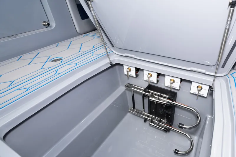  Yacht Photos Pics 2023 Deep Impact 399 Sport boat storage compartment with hydraulic lift and control valves.