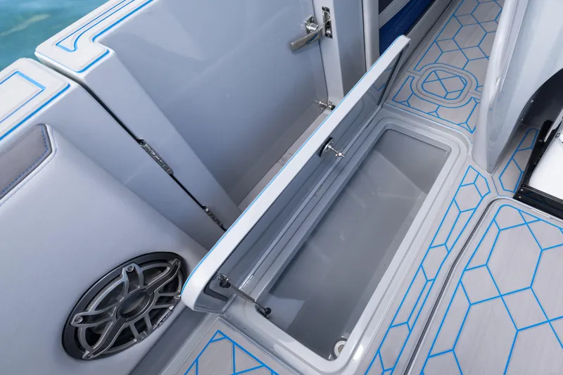  Yacht Photos Pics 2023 Deep Impact 399 Sport boat interior storage compartment with modern design and speaker.